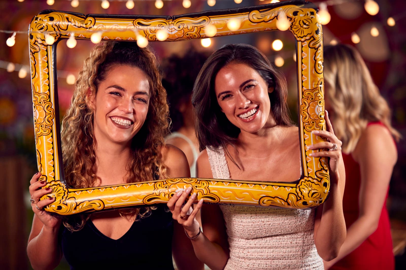 Friends having fun in a photo booth
